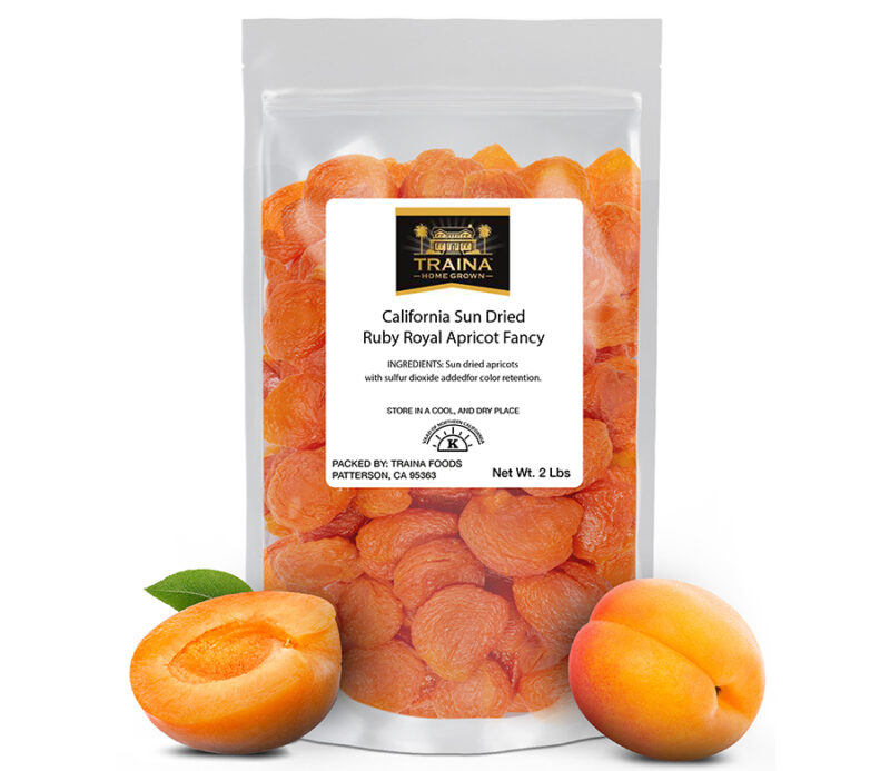 2 lb bag of our California Sun Dried Ruby Royal Apricots, Fancy with two fresh apricots displayed in front to show context.