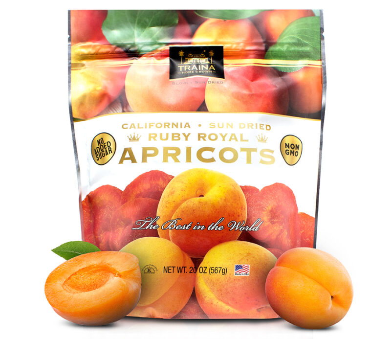 Traina Home Grown 20 oz resealable bag of California Sun Dried Ruby Royal Apricots. Fruit has a vibrant orange-red color, sweet-tangy flavor.